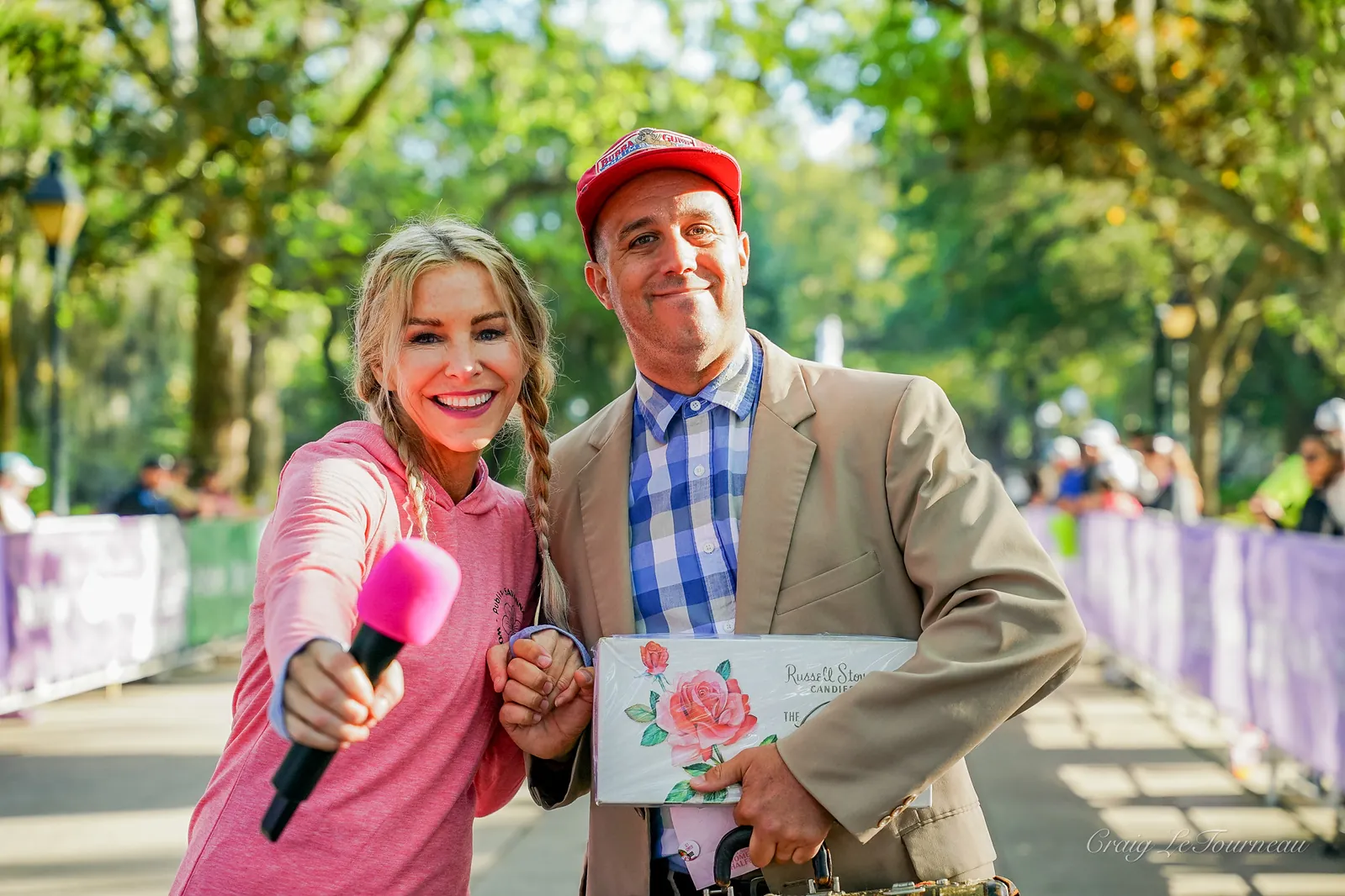 Guest smiling with the Get Gumped performer at a race